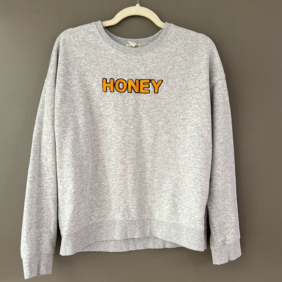 Forever 21 sweatshirt. Gray with the word “HONEY” in golden yellow.  Medium - Picture 1 of 6
